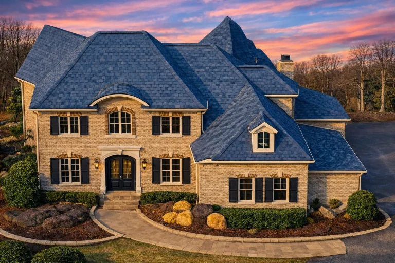 Front elevation of a Traditional Colonial style home with painted brick exterior, symmetrical windows, and classic shutter detailing