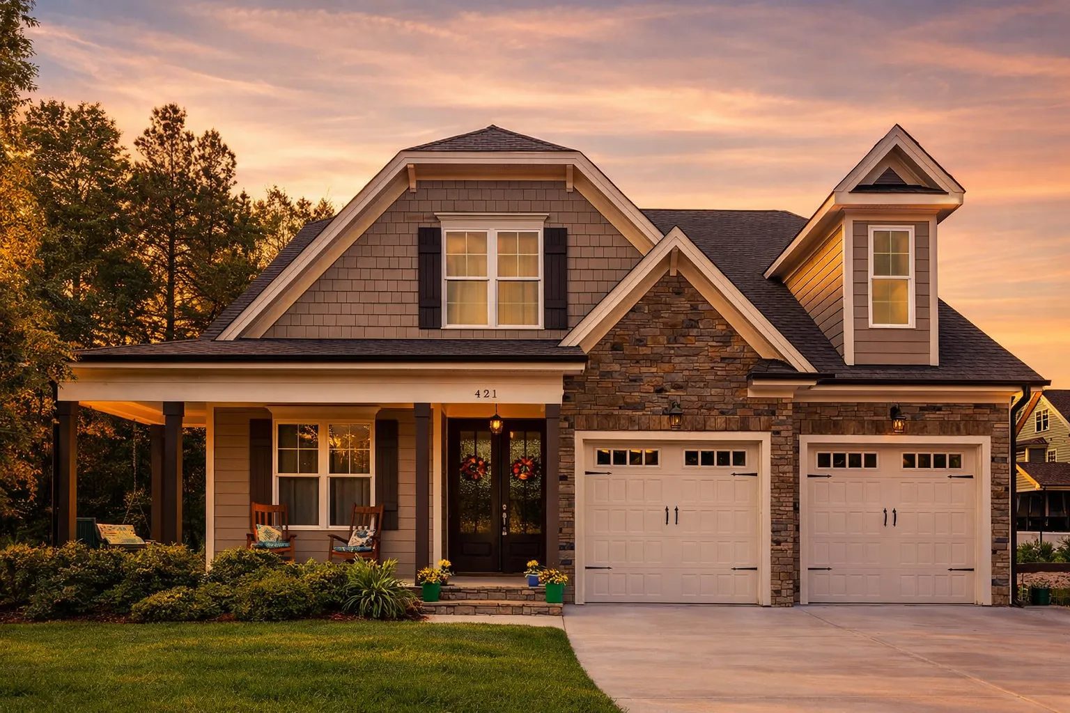 Front elevation of a New American Craftsman home featuring stone accents, horizontal siding, gabled rooflines, and a welcoming covered porch