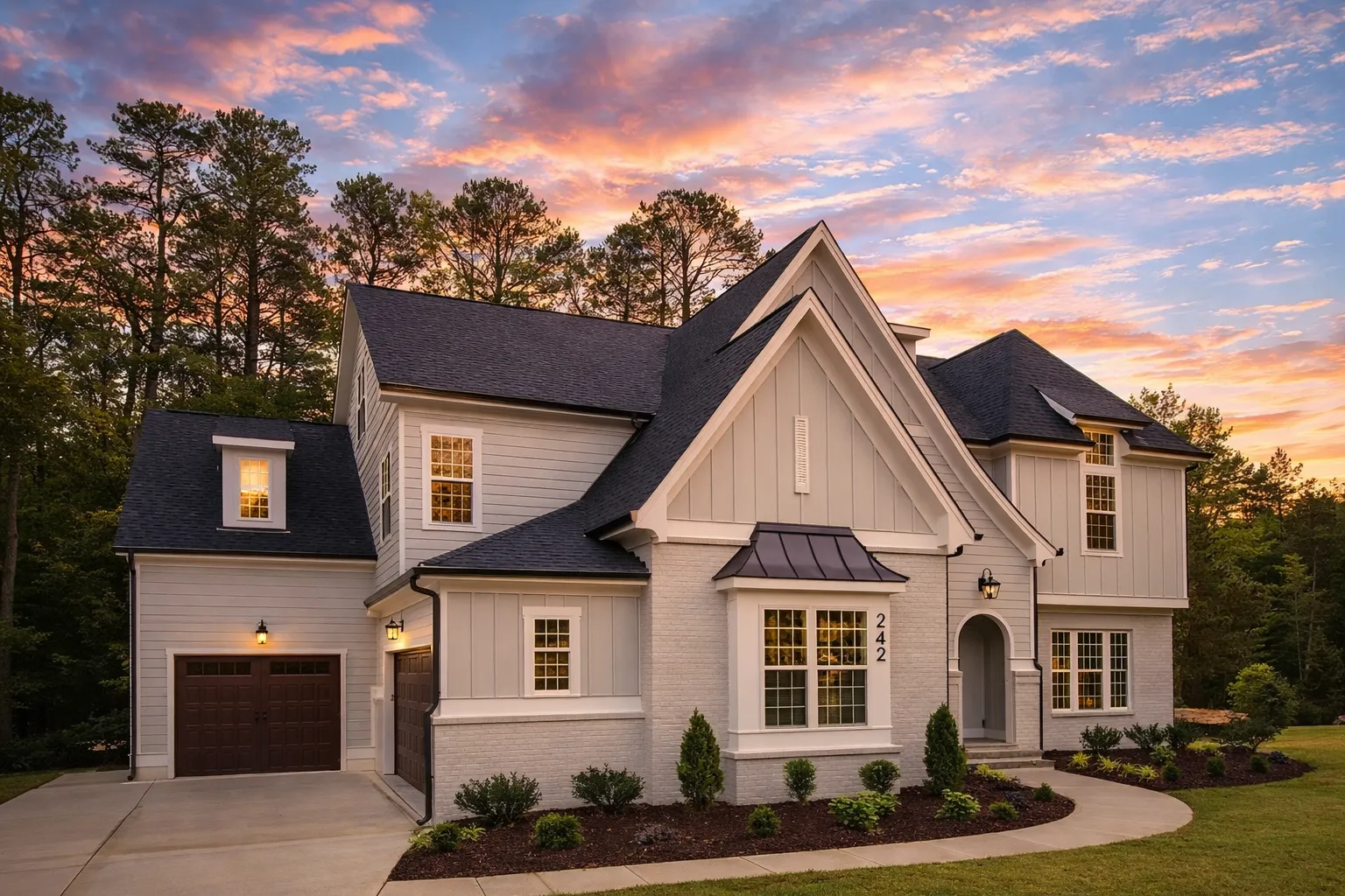 Front exterior of a New American Modern Traditional house featuring painted brick, board and batten siding, steep gables, and symmetrical window design