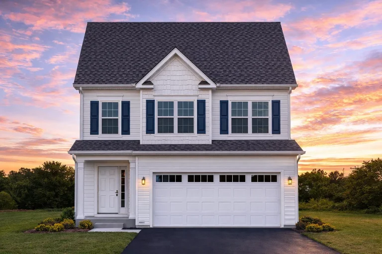 Front elevation of a Traditional Colonial style two-story home with a mix of siding, board and batten, and stone exterior, featuring a gable roof and front-entry garage