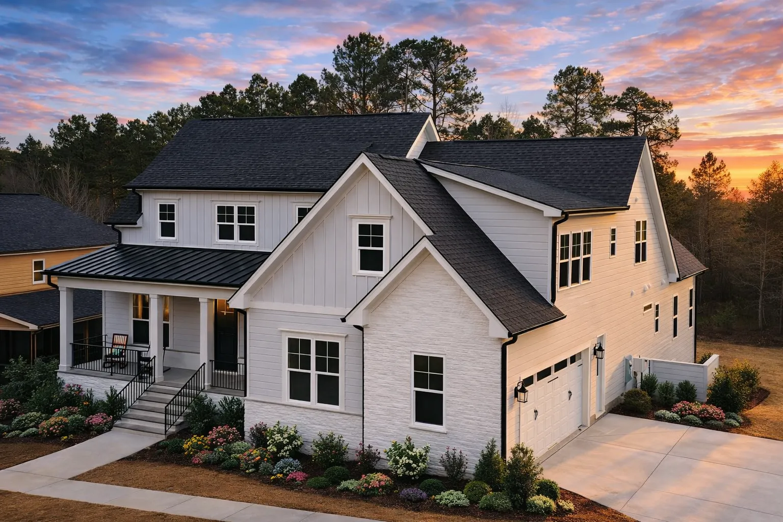 Front elevation of a modern farmhouse style home featuring white board and batten siding, brick accents, metal porch roof, and a welcoming covered front porch