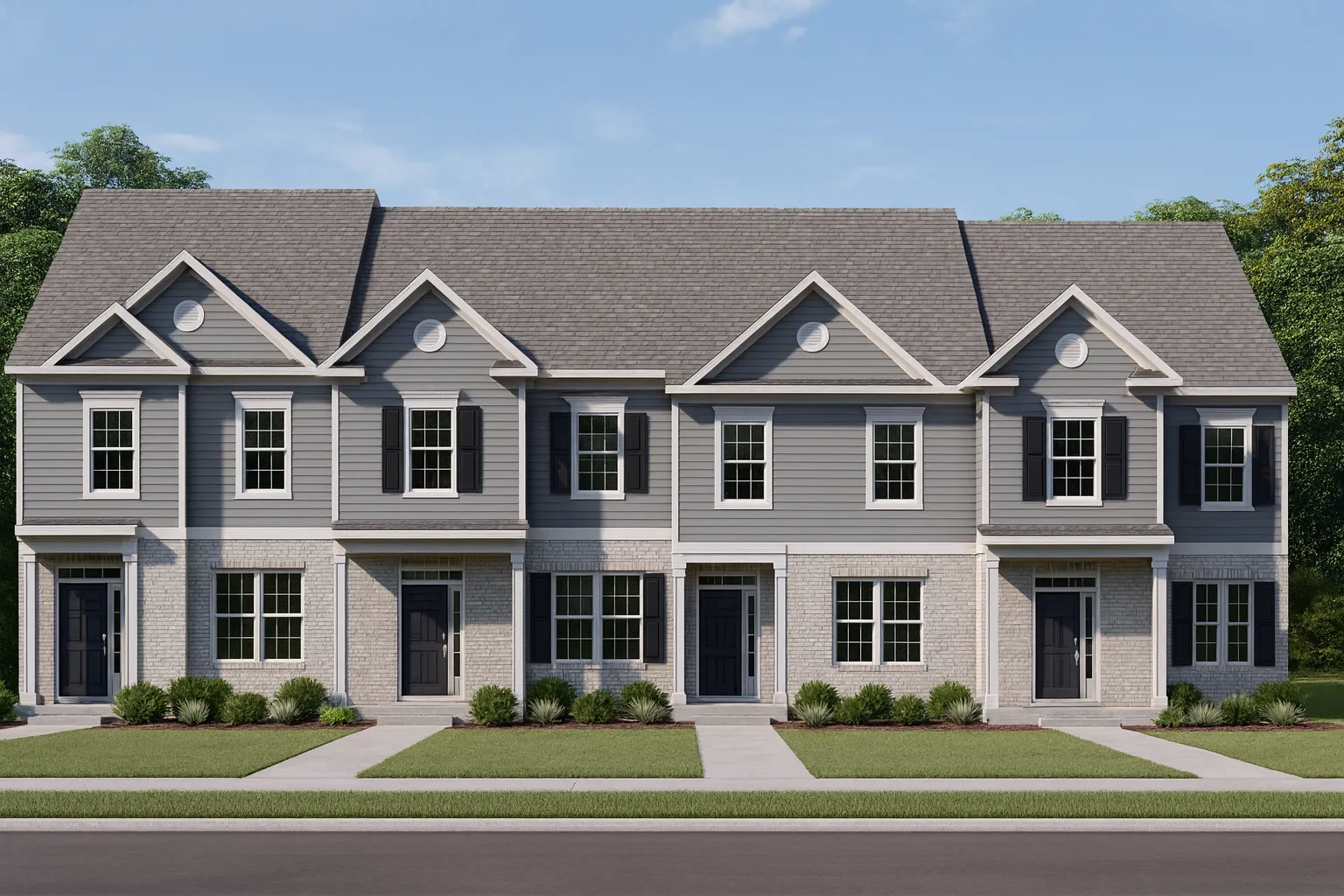 Front elevation of a Colonial Revival style home featuring light siding, black shutters, and a stone-accented foundation beneath a steep gable roof.