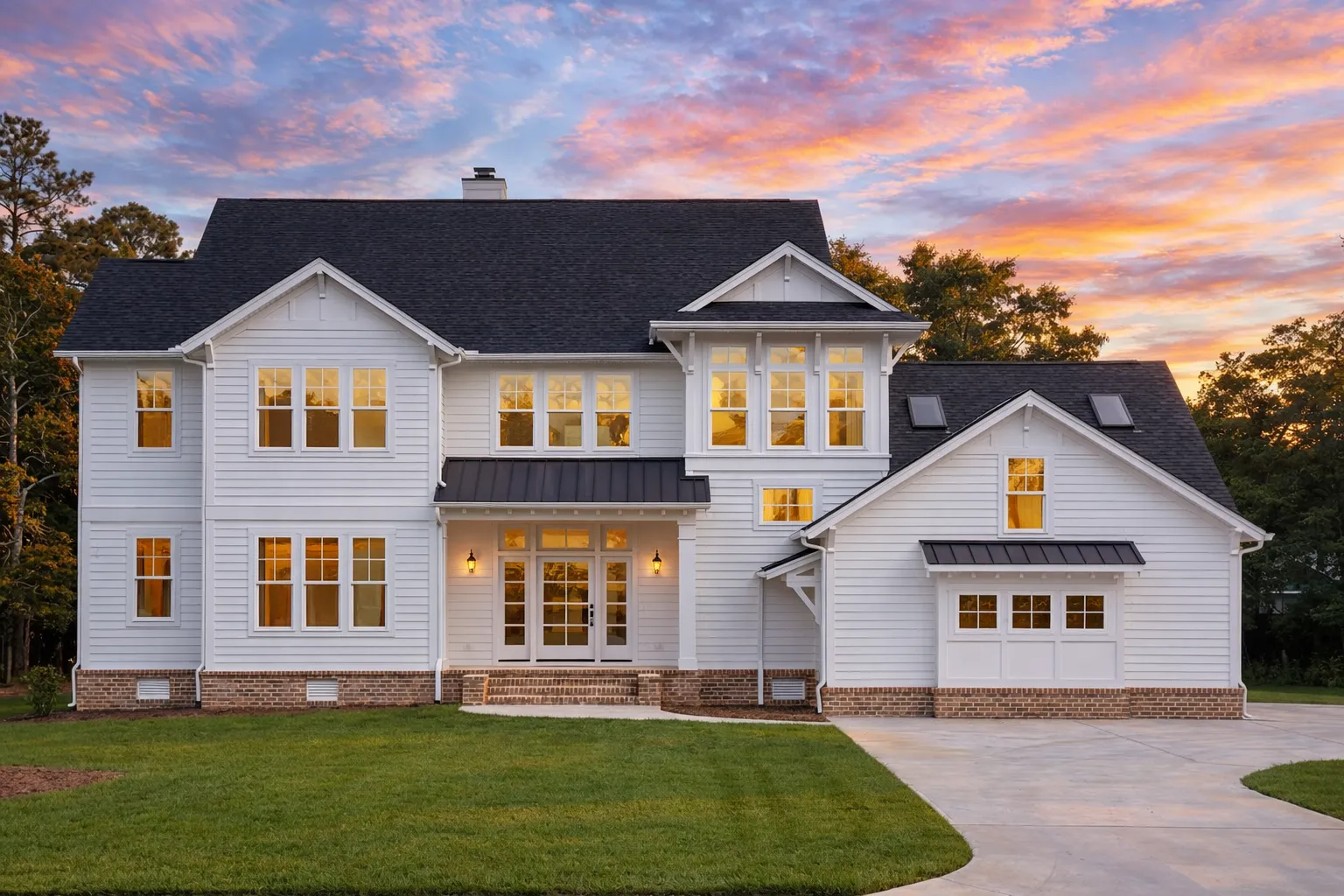 Front elevation of a New American Modern Farmhouse with board and batten siding, black windows, metal porch roof, and attached garage