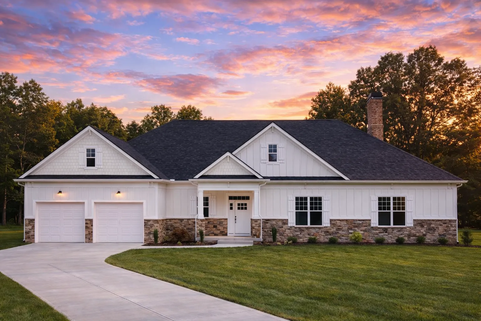 Front exterior of a Georgian Colonial style home with brick and stone exterior, symmetrical windows, hipped roof, and refined traditional detailing