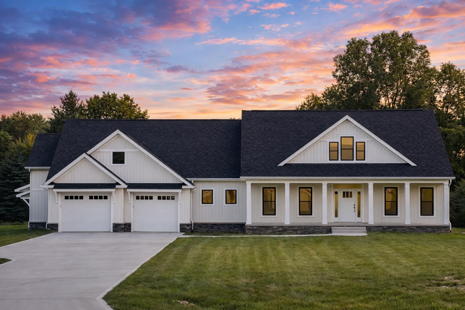 Barn Style House Plans 7 Front elevation of a modern farmhouse style home with board and batten siding, gabled rooflines, front porch, and attached garage