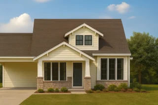 Front view of a Traditional Ranch style house featuring horizontal lap siding, stone wainscoting, gable rooflines, and clean suburban curb appeal