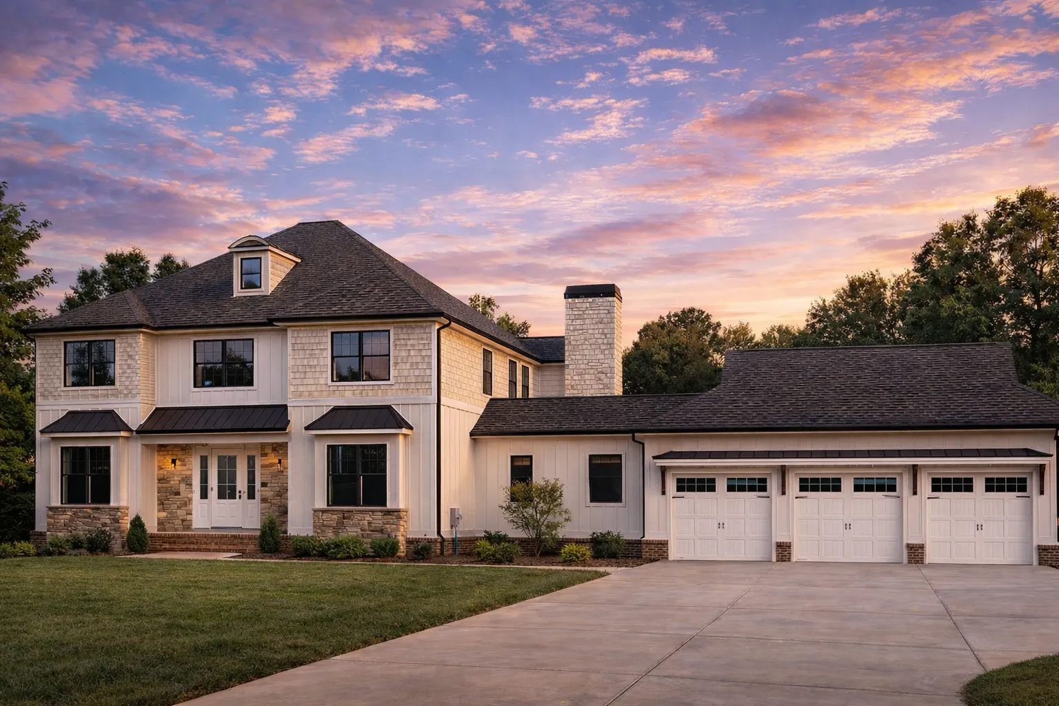 Front exterior of a Traditional Colonial style home featuring brick facade, horizontal siding, symmetrical windows, gabled rooflines, and a side-entry garage
