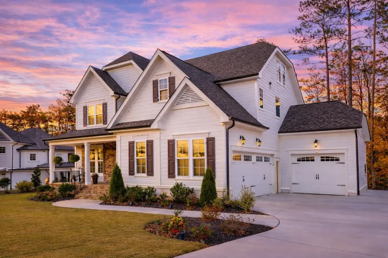 Front elevation of a New American (Modern Traditional) two-story house with horizontal lap siding, stone veneer accents, and brick porch steps
