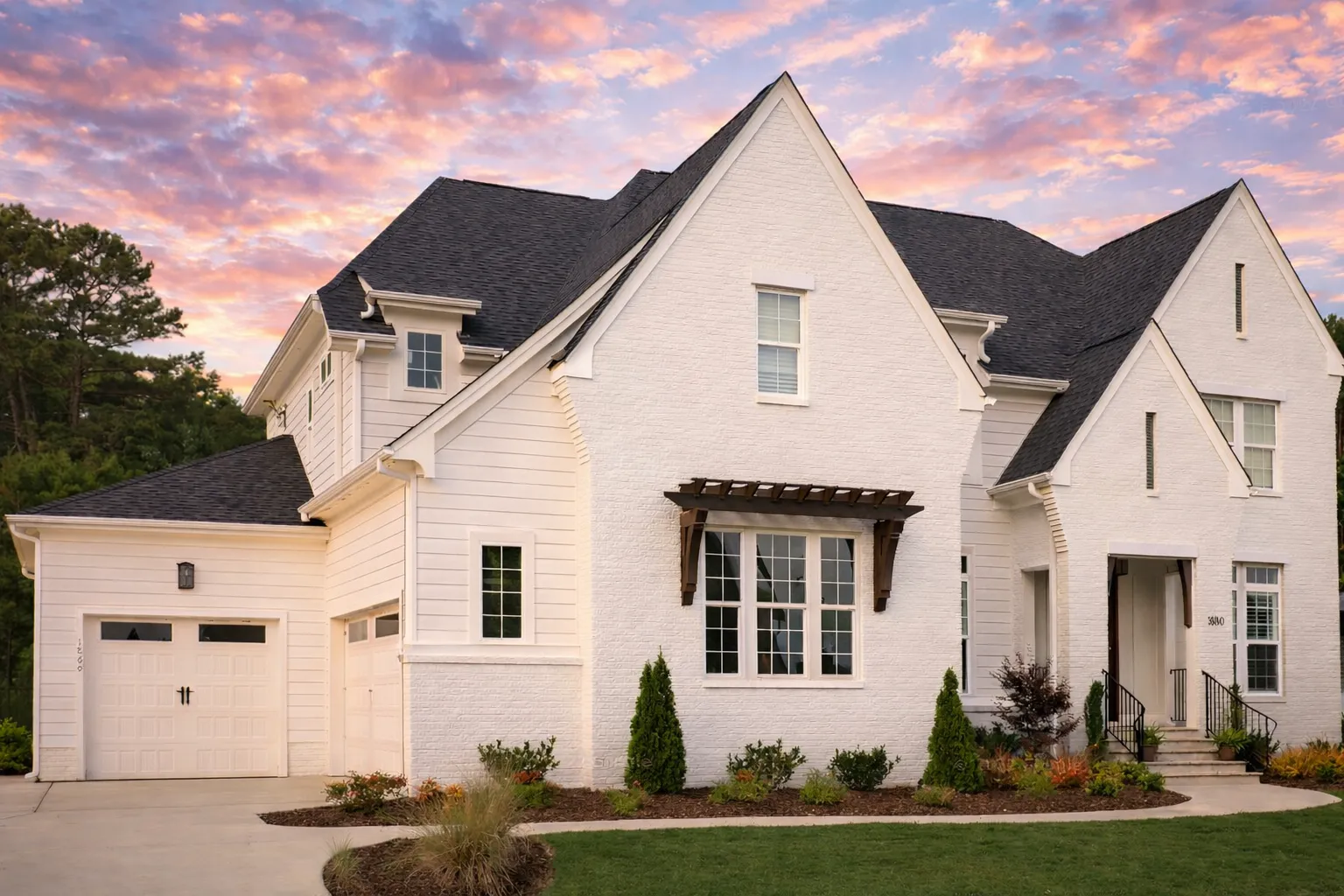 House Plans with Eating Bar 5 Front elevation of a New American modern traditional house with painted brick exterior, steep gables, symmetrical windows, and classic entry porch