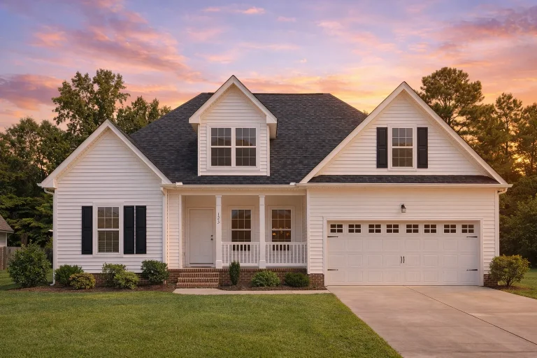 House Plans 5 Front elevation of a Traditional Suburban style home with horizontal lap siding, gabled rooflines, covered porch, and attached two-car garage