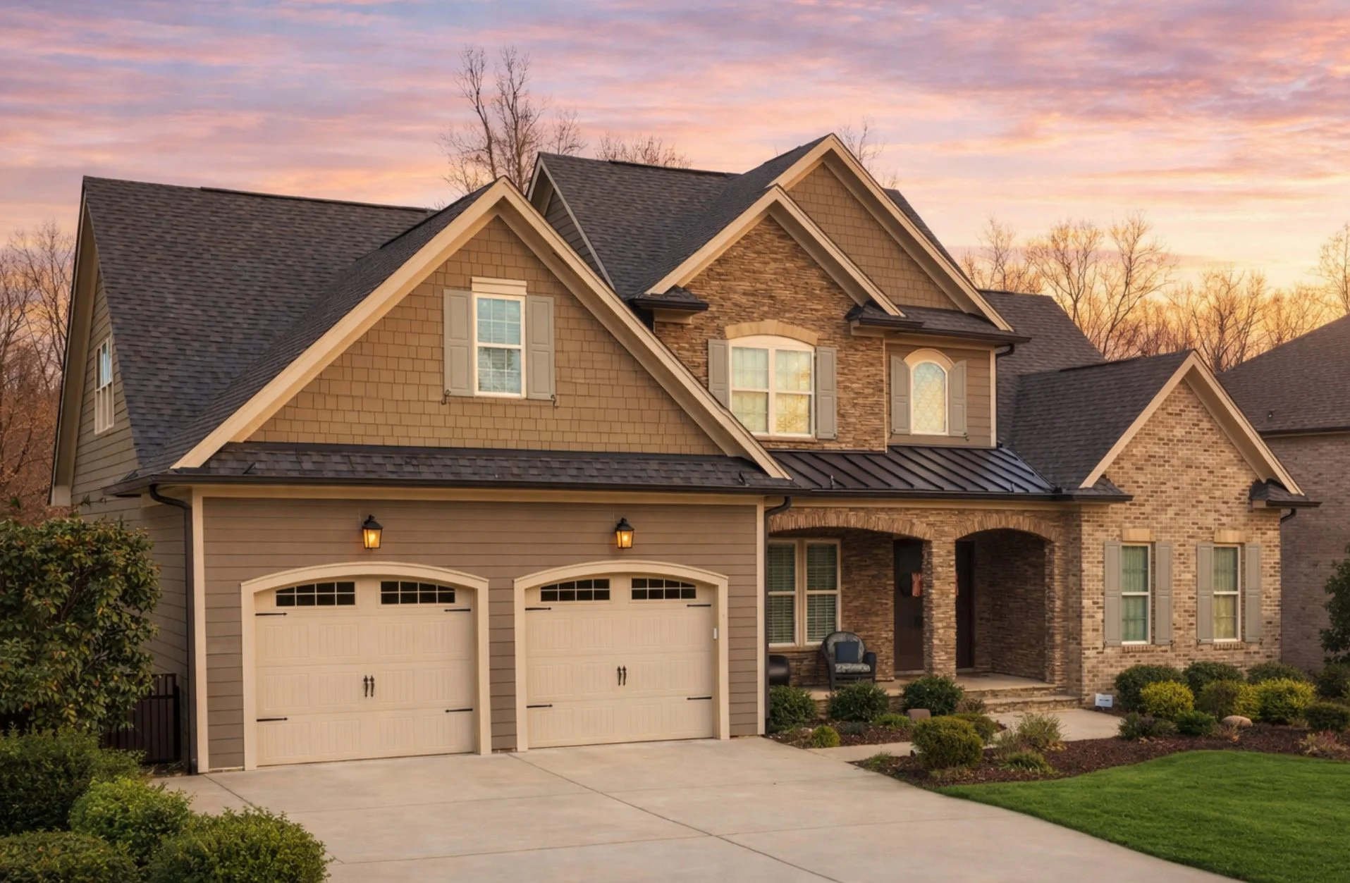 Front elevation of a New American modern traditional house featuring brick, stone, and horizontal siding