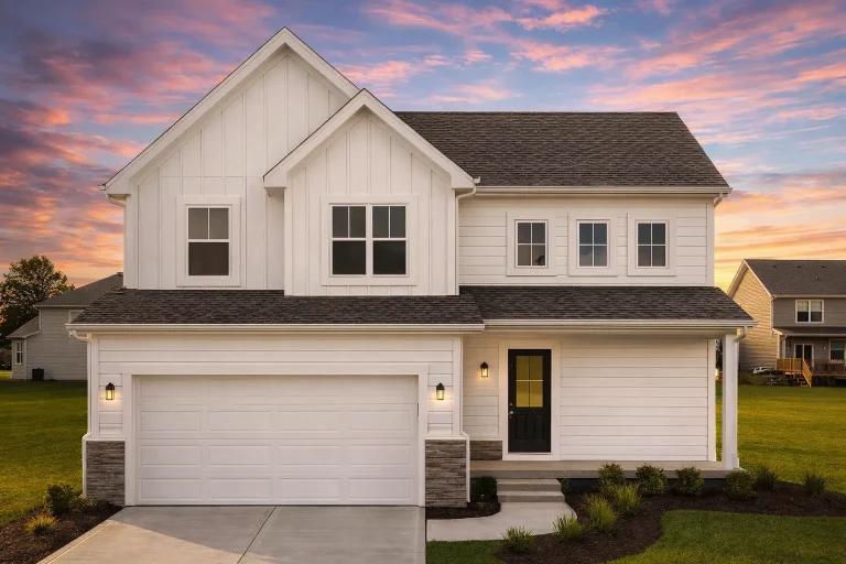 Front elevation of a New American farmhouse style home with blue horizontal siding, board and batten accents, stone base, and attached two car garage