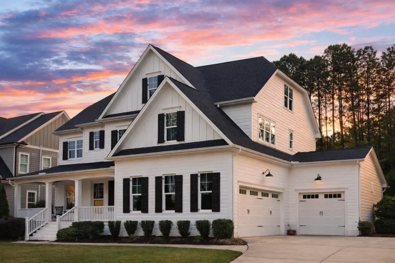 Front elevation of a New American Traditional style home featuring horizontal lap siding, board and batten accents, symmetrical Colonial façade, and covered front porch