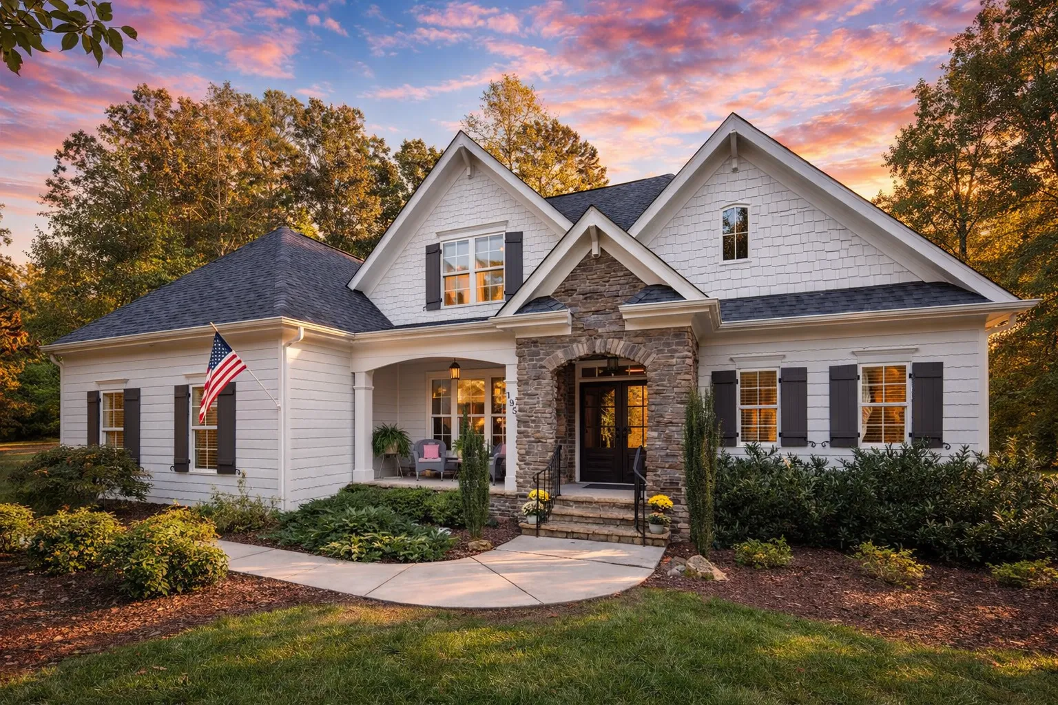 Craftsman Traditional house exterior with stone entry, gable roof, and front porch