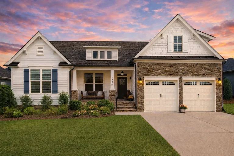 House Plans with Spacious Laundry Room 21 Front elevation of a Modern Farmhouse with white board and batten siding, gabled rooflines, covered front porch, and two-car garage