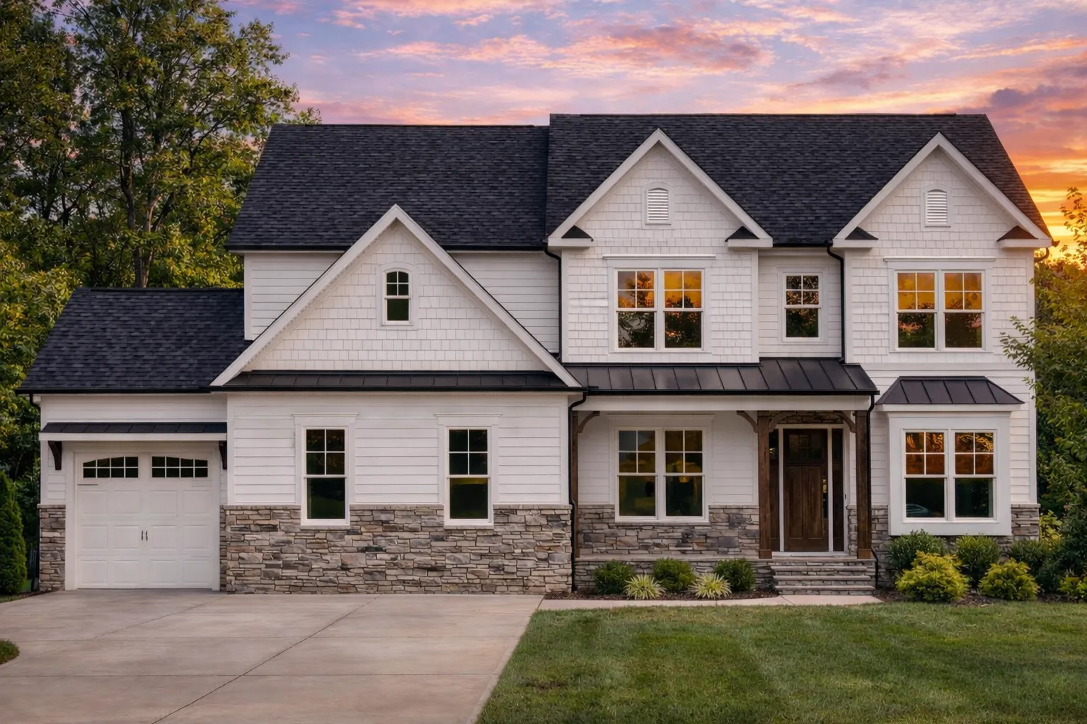 Front elevation of a New American modern traditional home featuring stone accents, horizontal siding, black shutters, and a covered entry porch
