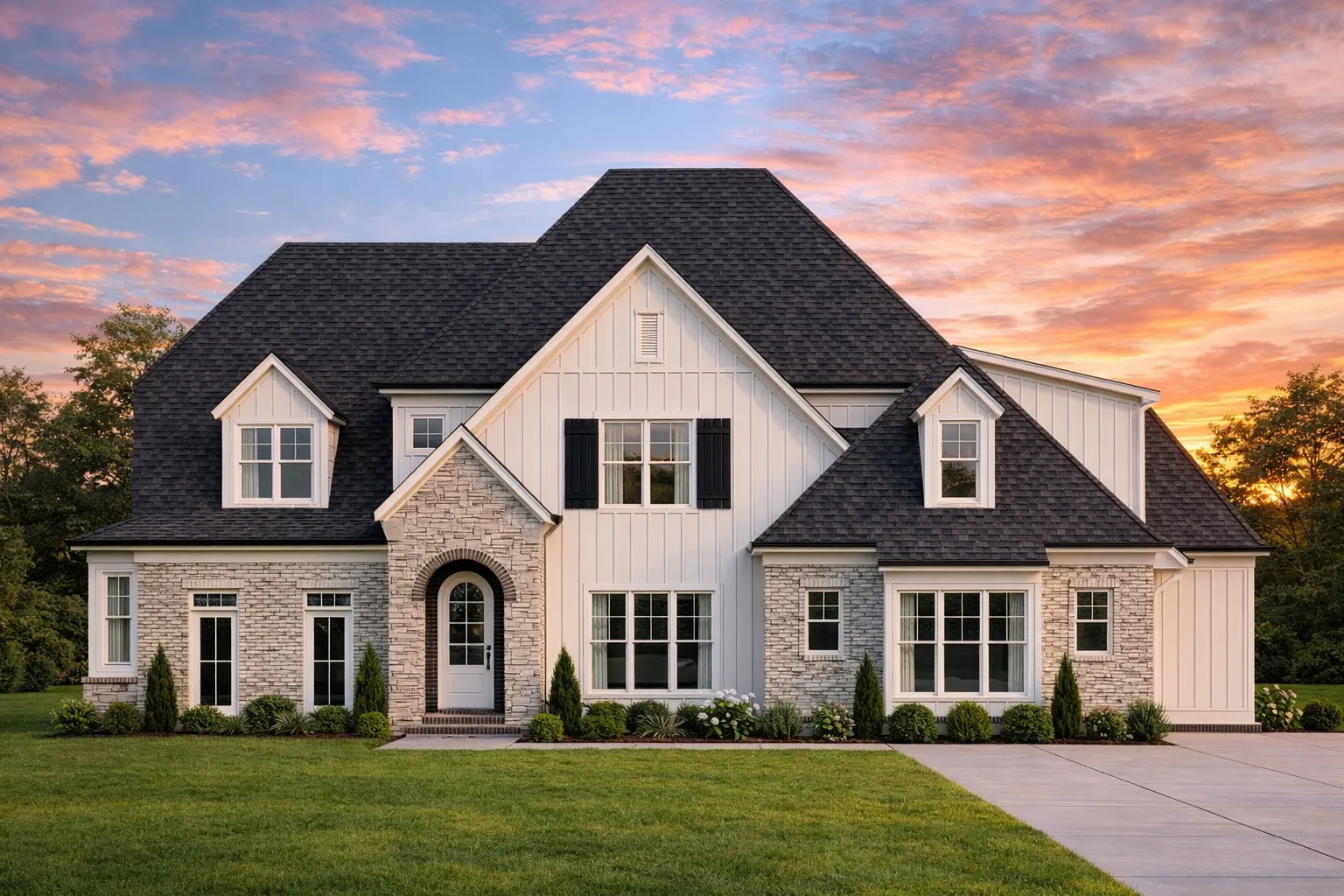 Front exterior of a New American Traditional house with painted brick, stone arched entry, board-and-batten gables, and steep shingle roof