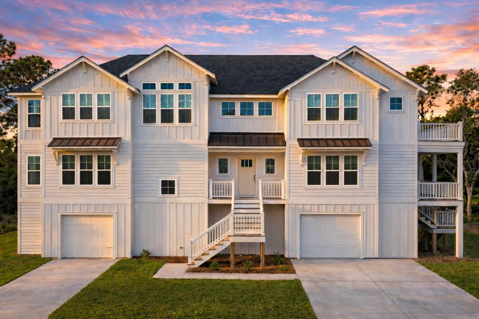 Bungalow House Plans 19 Front elevation of a New American traditional duplex house featuring horizontal siding, stone veneer base, symmetrical gables, and raised garage level