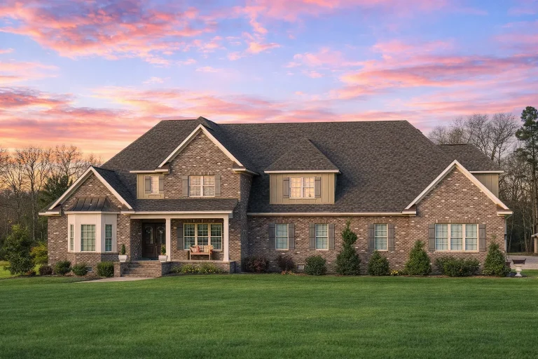 Front elevation of a Traditional Colonial New American style home with red brick exterior, multi-gabled roof, and balanced window layout