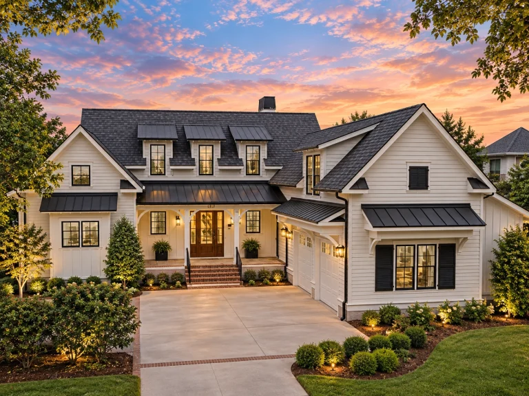 Front elevation of a Cape Cod style home with horizontal siding, stone foundation, dormer windows, and covered front porch