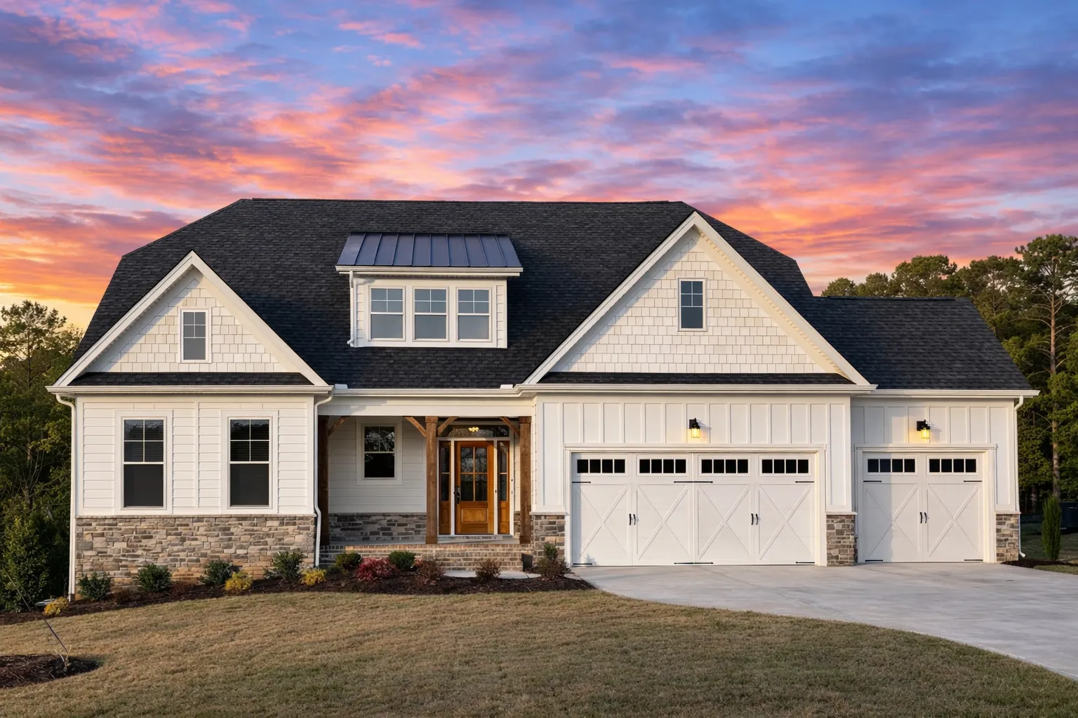 Front elevation of a Craftsman Traditional home featuring stone accents, board and batten siding, and a welcoming covered porch with gabled rooflines.