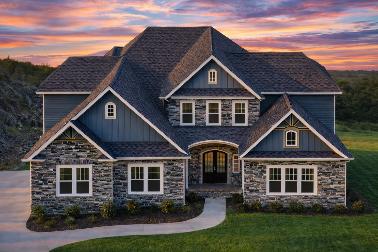 Front elevation of a New American style two-story home with stone veneer, horizontal siding, gabled rooflines, and covered entry porch