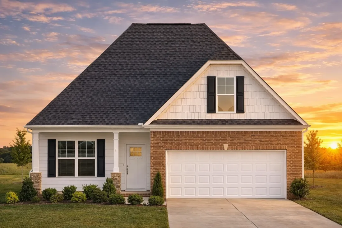 Front elevation of a Traditional Ranch style home with beige horizontal siding, black shutters, and partial stone base accents under a steep gable roof.
