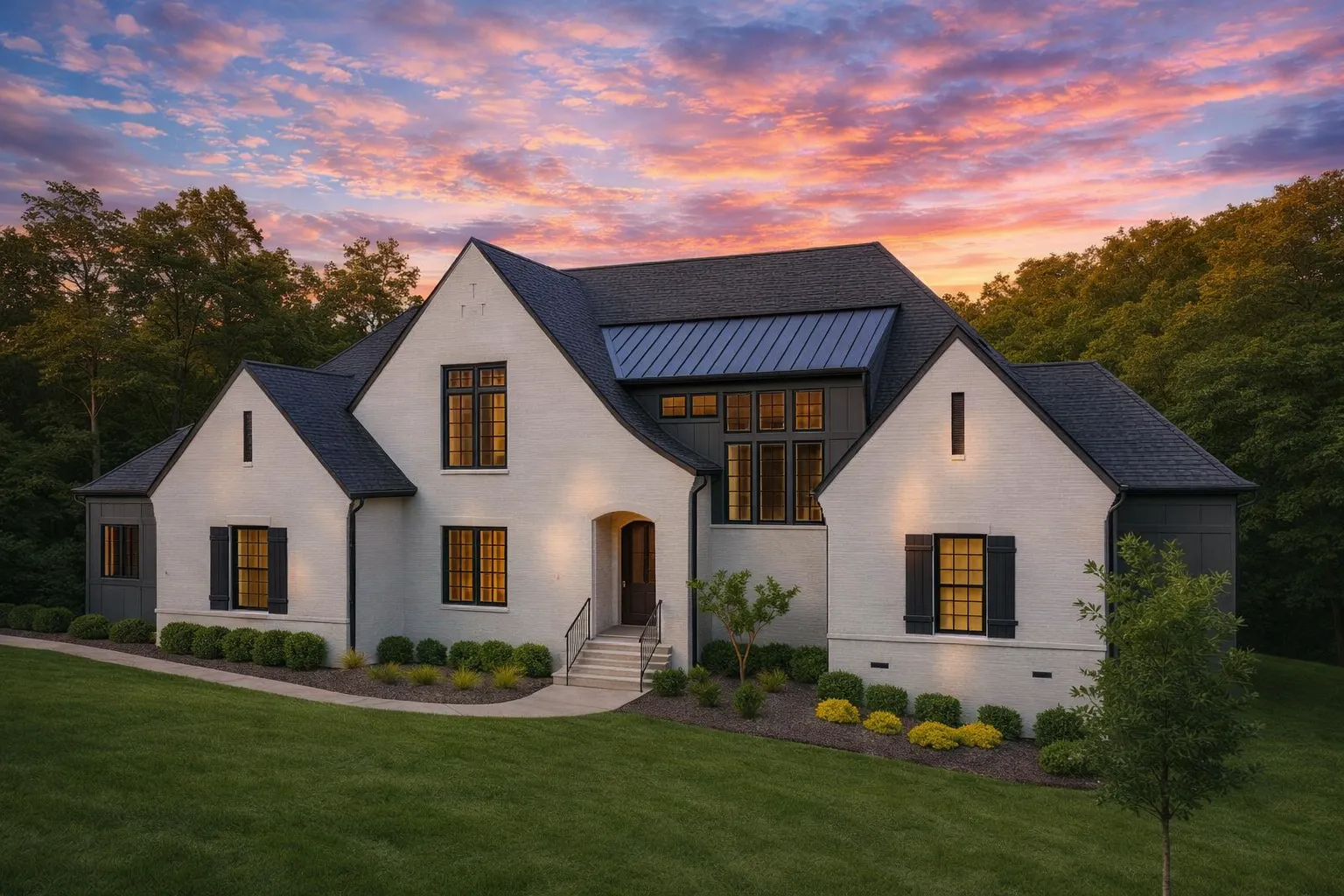 Prairie House Plans 1 Front exterior of a New American modern traditional house with painted brick facade, steep gabled rooflines, dark windows, and manicured landscaping
