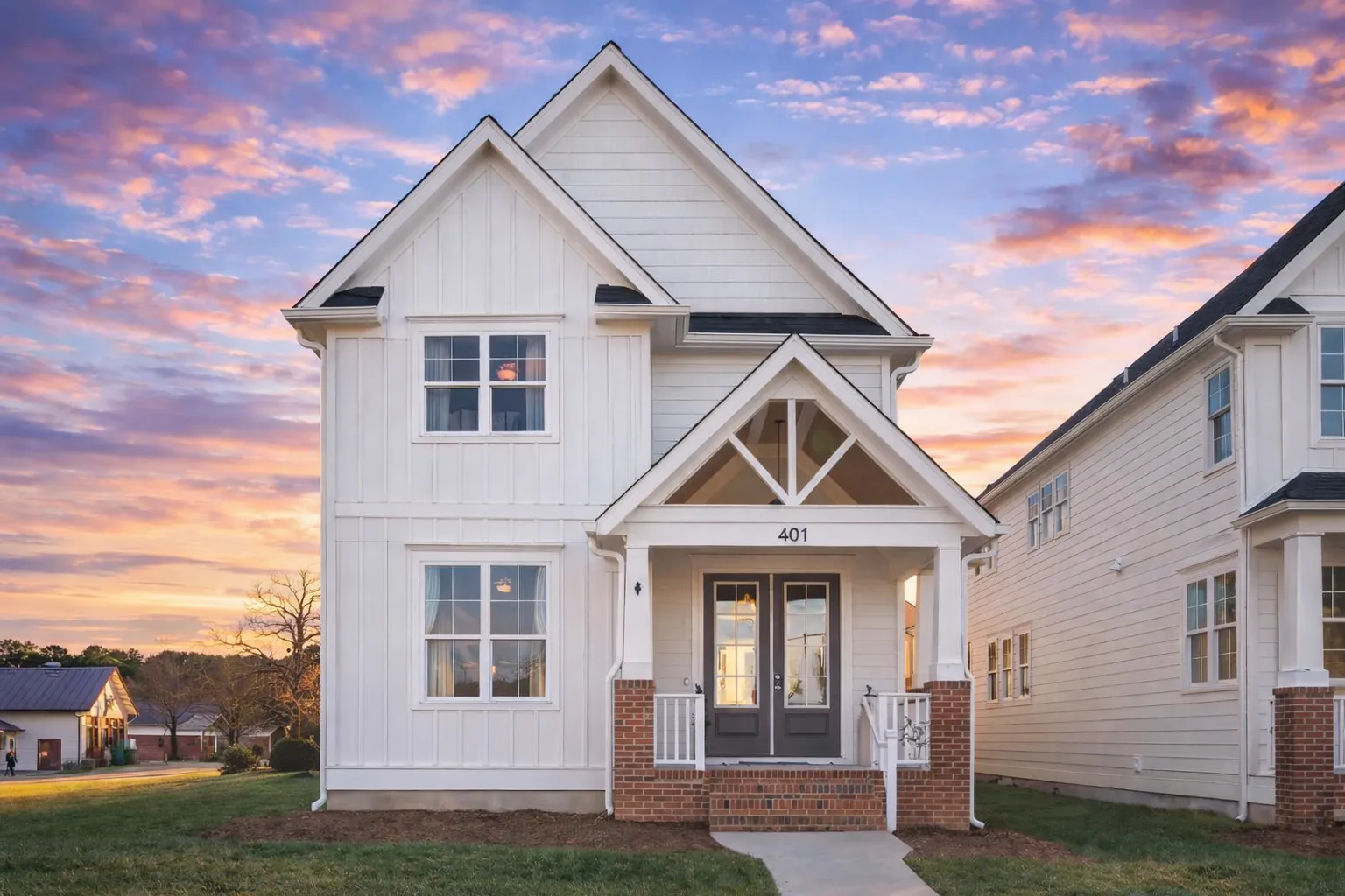 4 Bedroom House Plans 18 Front elevation of a Modern Farmhouse Craftsman style home with board and batten siding, stone foundation, and covered porch entry
