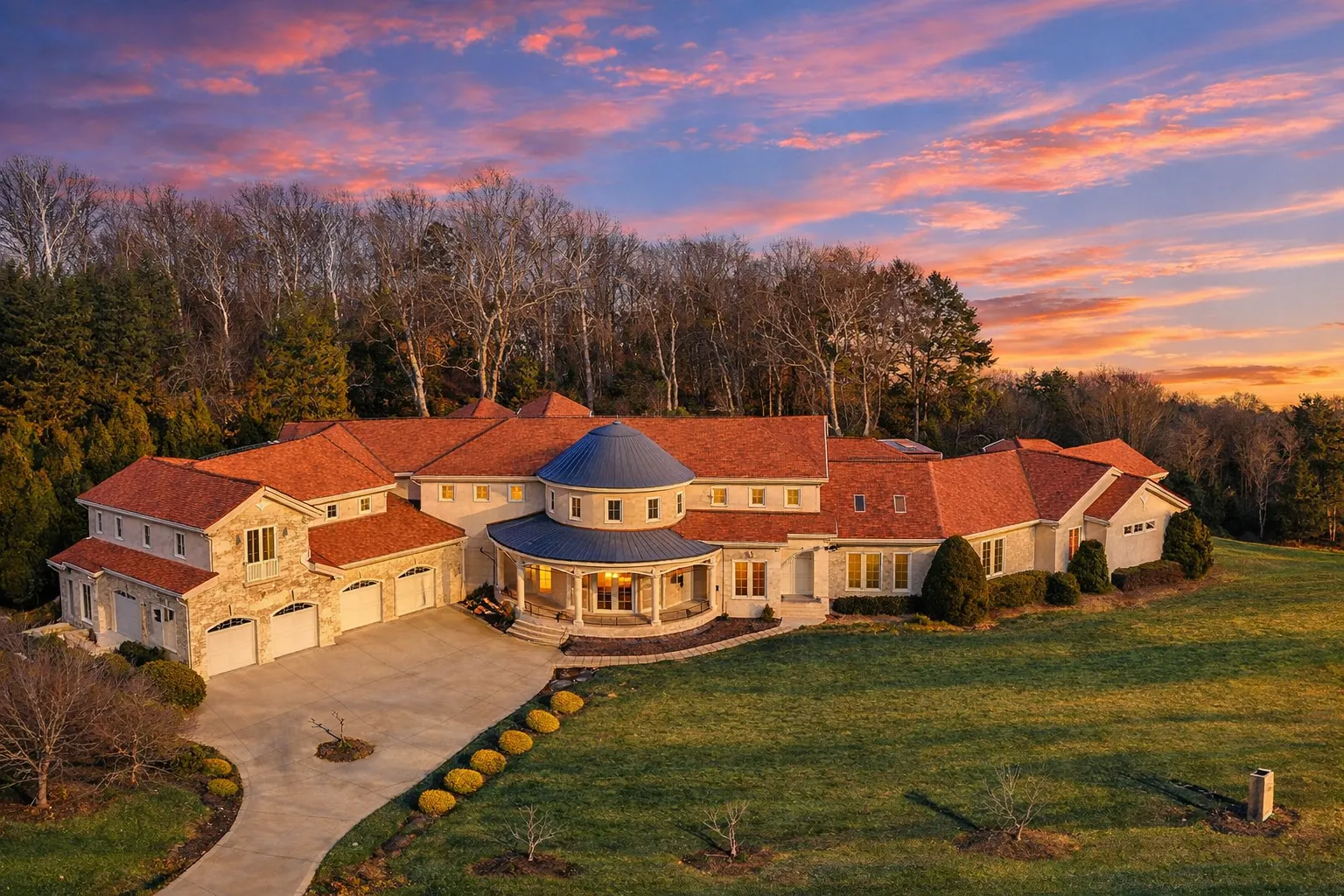 Front exterior of a New American style home with painted brick, horizontal siding, multiple gables, and a covered entry porch