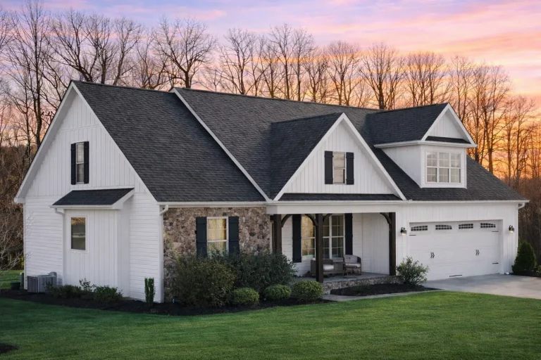 Front elevation of a Traditional Ranch Craftsman style home featuring stone accents, board and batten with horizontal siding, and a welcoming covered porch entry