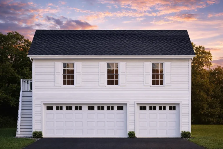 Front elevation of a carriage house garage apartment featuring horizontal siding, metal roof, three-car garage, and traditional window shutters