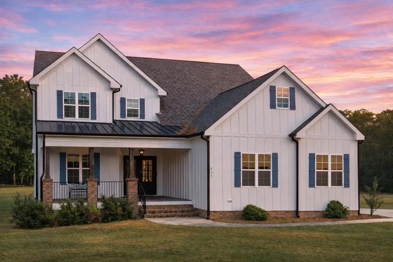 Front elevation of Craftsman style home with horizontal lap siding, stone wainscot, gabled rooflines, and covered front porch
