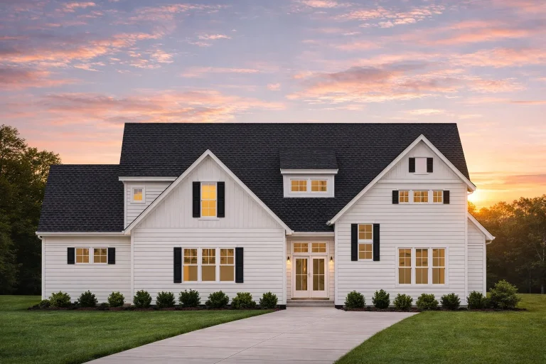 Front elevation of a Modern Farmhouse home with board and batten siding, horizontal lap siding, stone accents, gabled roof, and black framed windows