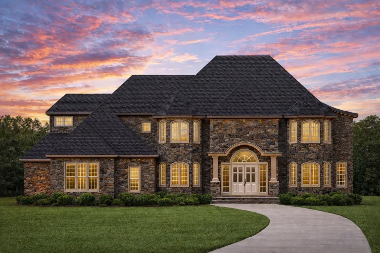 Front elevation of a Georgian Revival and Traditional Colonial brick home with stone accents, symmetrical façade, arched central entry, and hip roof
