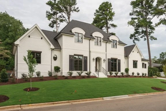 modern-farmhouse-white-brick-home-black-shutters-front-elevation