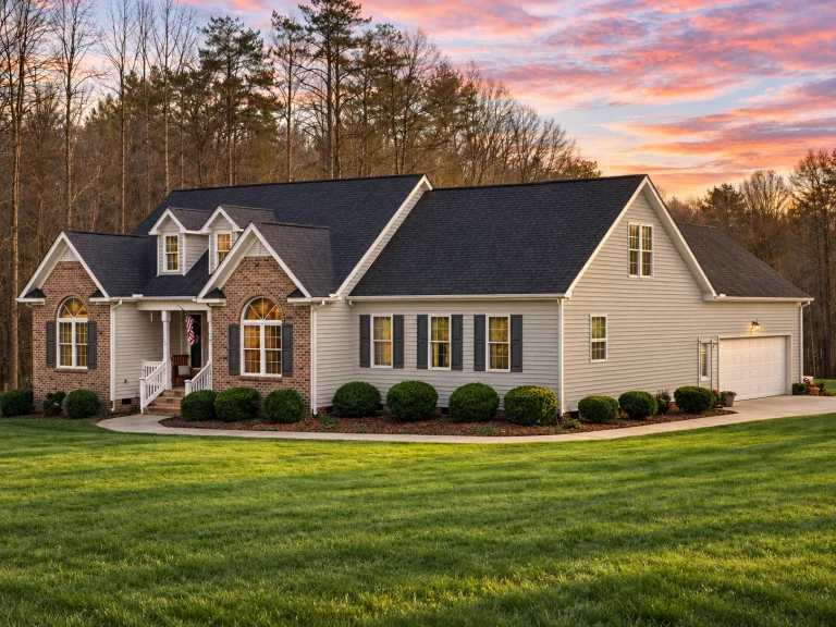 Classical House Plans 10 Front elevation of a Traditional Colonial style home featuring a brick façade, horizontal siding, dormers, and symmetrical architectural detailing