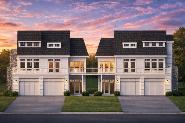 Front elevation of a Coastal Farmhouse style garage apartment featuring horizontal siding, standing seam metal roof, stone base, and second-floor balcony
