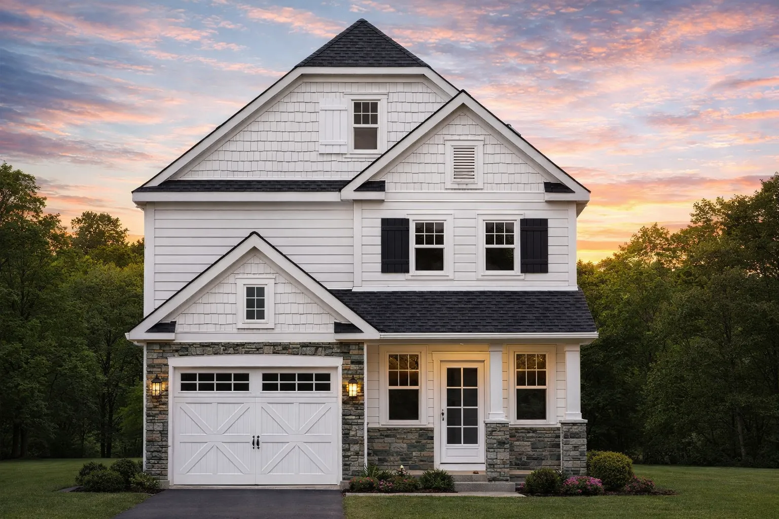 Front view of Modern Farmhouse with board and batten siding, stone base, metal roof accents, and symmetrical windows