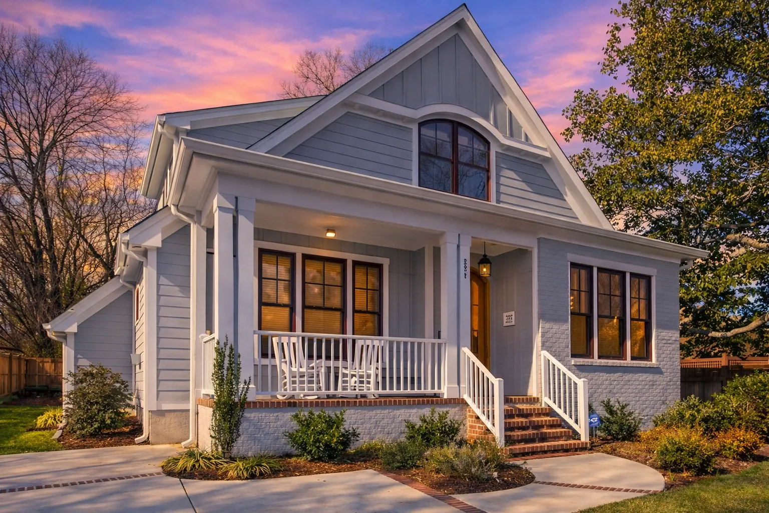House Plans with Terrace 25 Front elevation of a Traditional Colonial style home with brick exterior, board and batten gable accent, symmetrical windows, and covered entry porch