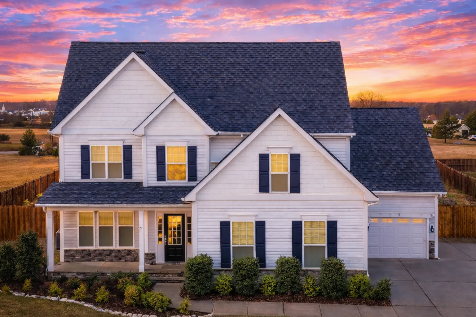 House Plans with Terrace 15 Front elevation of a New American Traditional style house featuring horizontal siding, stone wainscot, symmetrical windows, and a covered porch