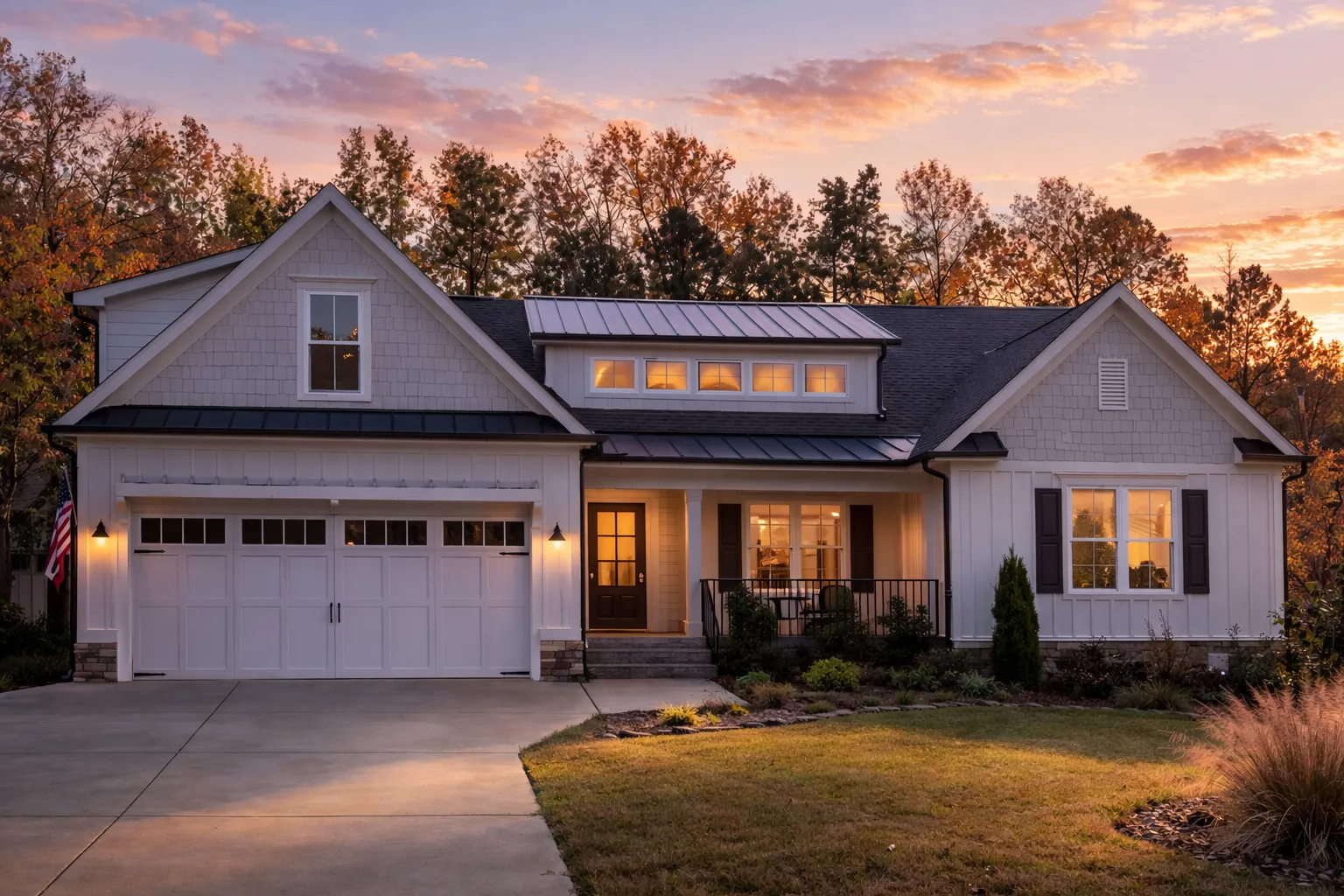 Front elevation of a modern farmhouse New American home with board-and-batten siding, stone veneer base, covered porch, and 2-car garage