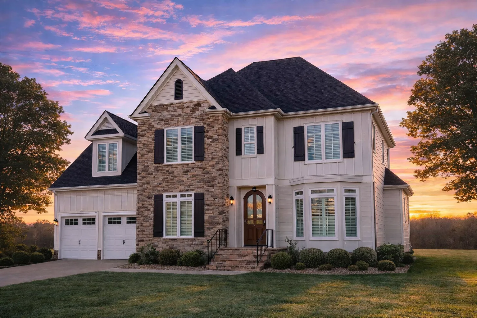 Front elevation of a New American Modern Traditional house with stone exterior, board-and-batten siding, blue shutters, and attached two-car garage