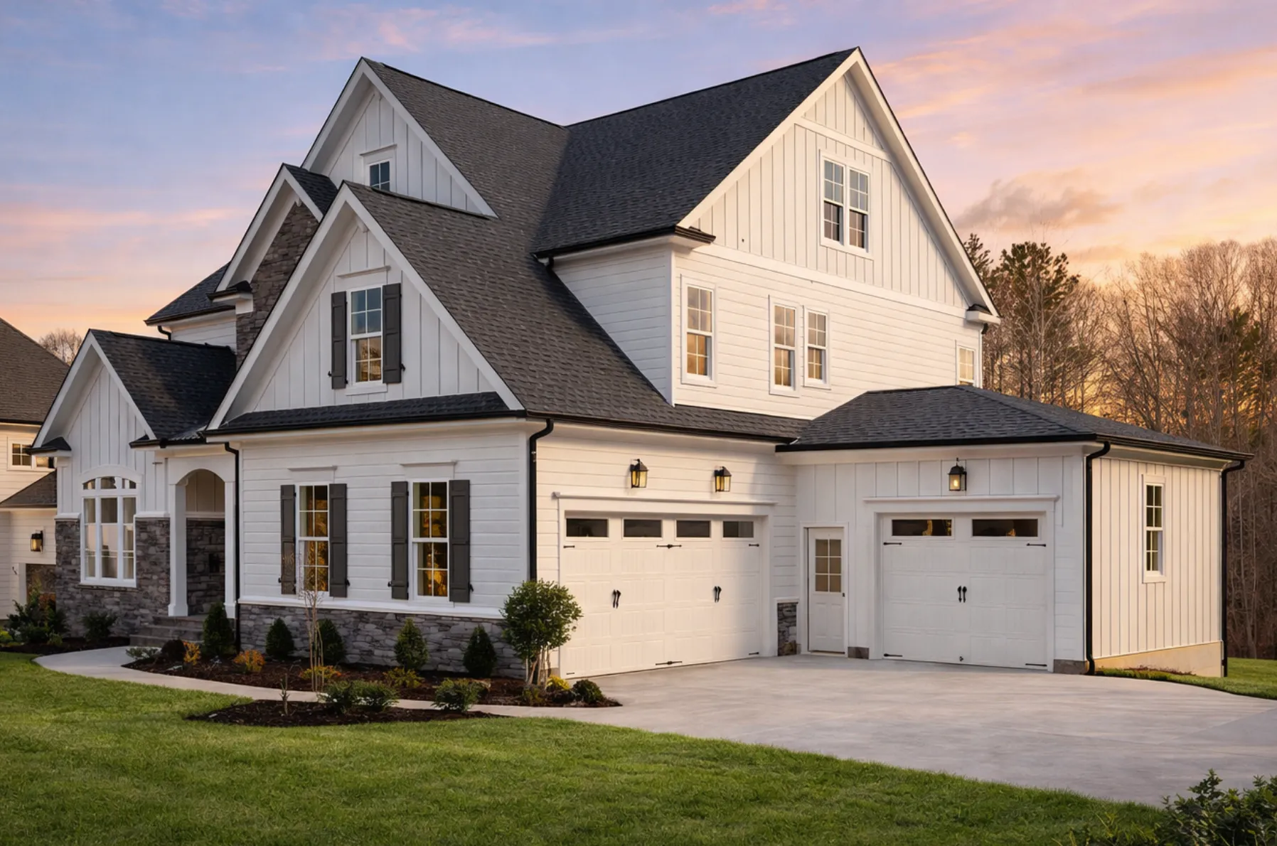 Front elevation of a Traditional Colonial New American style home with horizontal siding, stone accents, symmetrical windows, and covered entry