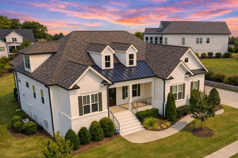 Front elevation of a New American style home with board and batten siding, covered porch, and classic suburban curb appeal