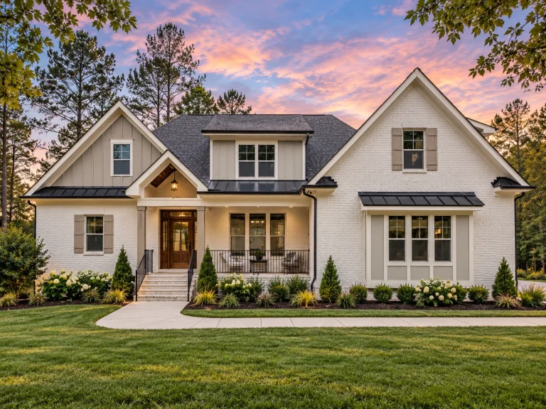 Modern Suburban House Plans 15 Front elevation of a New American farmhouse style home featuring horizontal lap siding, board and batten details, gabled rooflines, and welcoming covered porch