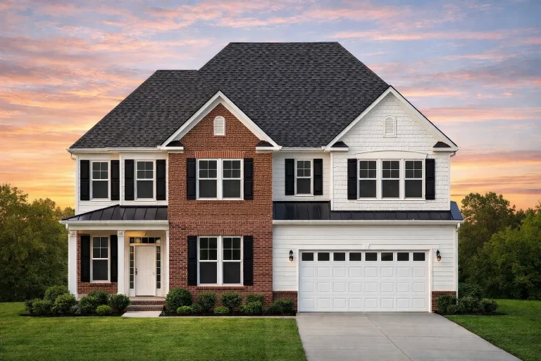 Front exterior of a New American style home with stone accents, horizontal siding, gabled rooflines, and a two-car garage