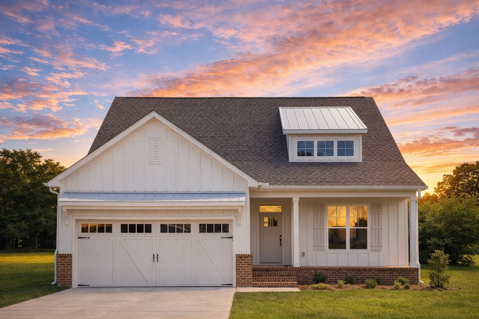 Front view of a Modern Farmhouse style home featuring board and batten siding, horizontal lap siding, and brick accents with a front porch and dormer window.