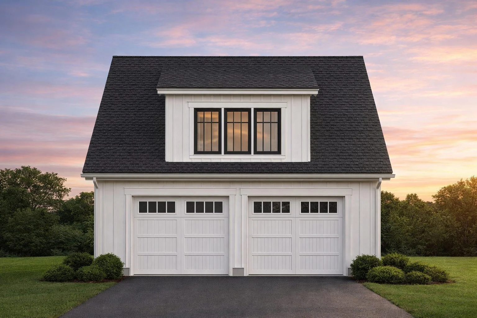 Front elevation of a Colonial Revival carriage house garage with traditional lap siding, symmetrical windows, and double garage doors