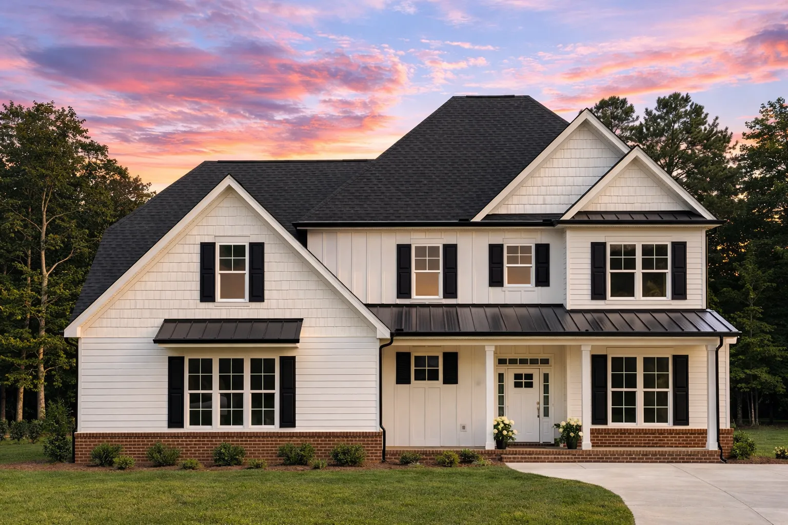 Front elevation of Traditional Colonial home with horizontal lap siding, stone veneer base, symmetrical windows, and gabled roof